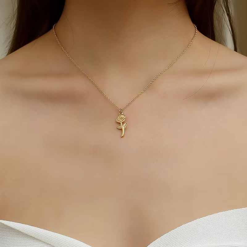 Gold rose necklace with stainless steel pendant, delicate floral jewelry, elegant gift for women.