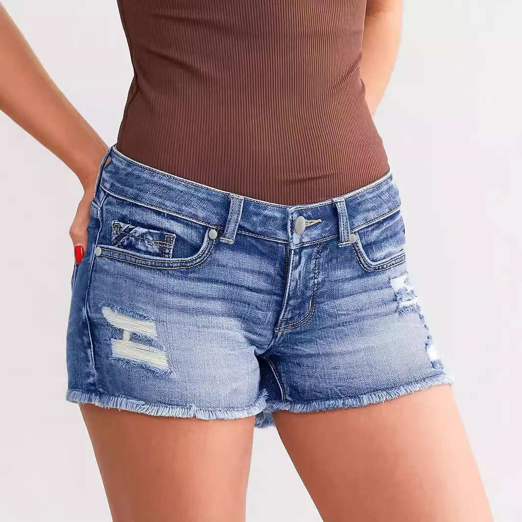 "Trendy ripped denim shorts – stylish street fashion, light blue distressed jean shorts for a chic casual look."