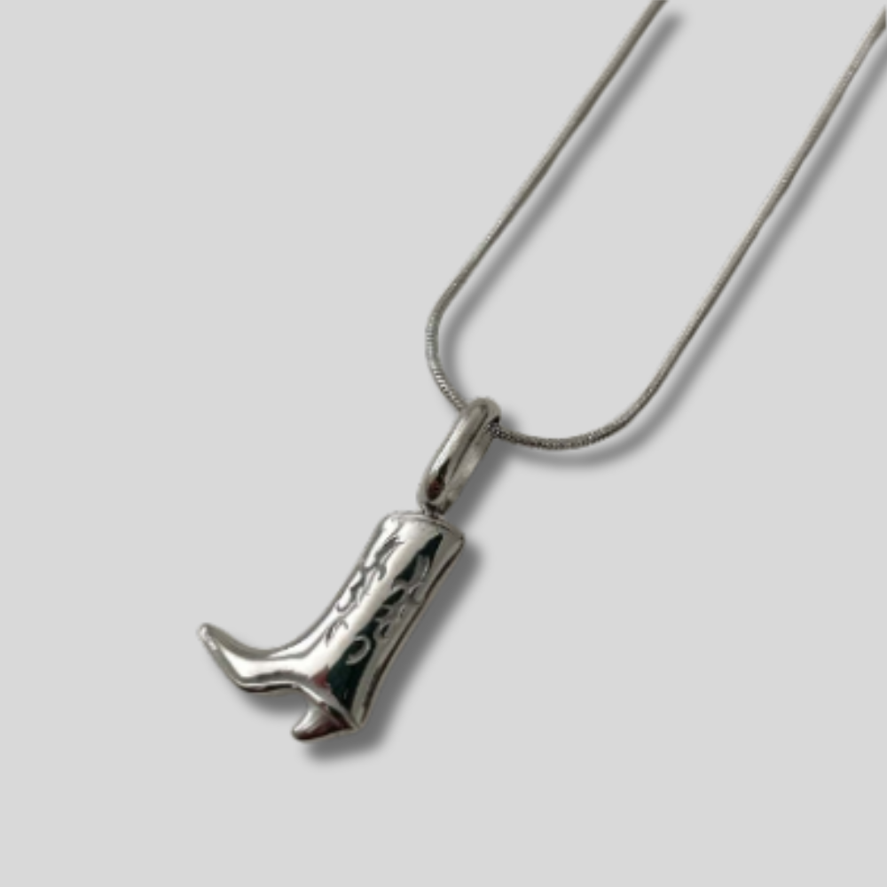 "Silver boot necklace with stainless steel pendant on adjustable chain – stylish Western-inspired jewelry"
