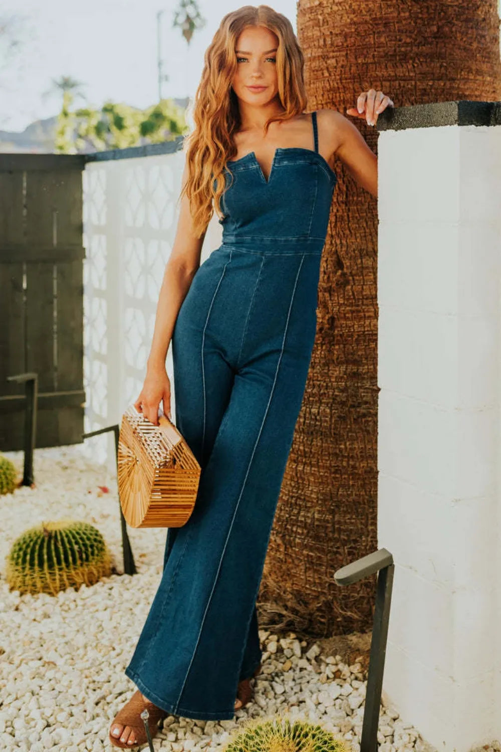 "Women's Spaghetti Strap Denim Jumpsuit with basic design and slight stretch, perfect for casual, stylish looks."