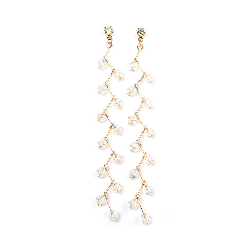 "Elegant long crystal tassel earrings with gold-tone wire and faceted beads – stylish statement jewelry"