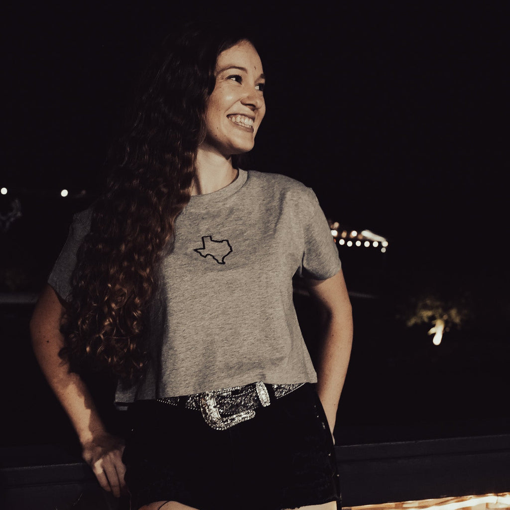 "Texas Crop – Stylish western-inspired women’s crop top in 100% combed cotton, perfect for casual outings and music festivals."